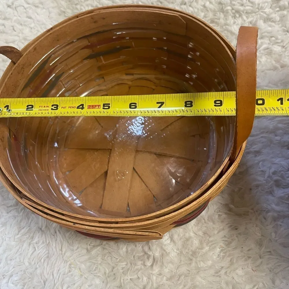 Longaberger 1995 set of two Handcrafted round and Square Woven baskets .